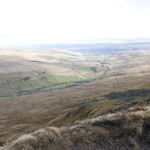 Road and train line through the valley looking from the steep edge on White Boar Fell