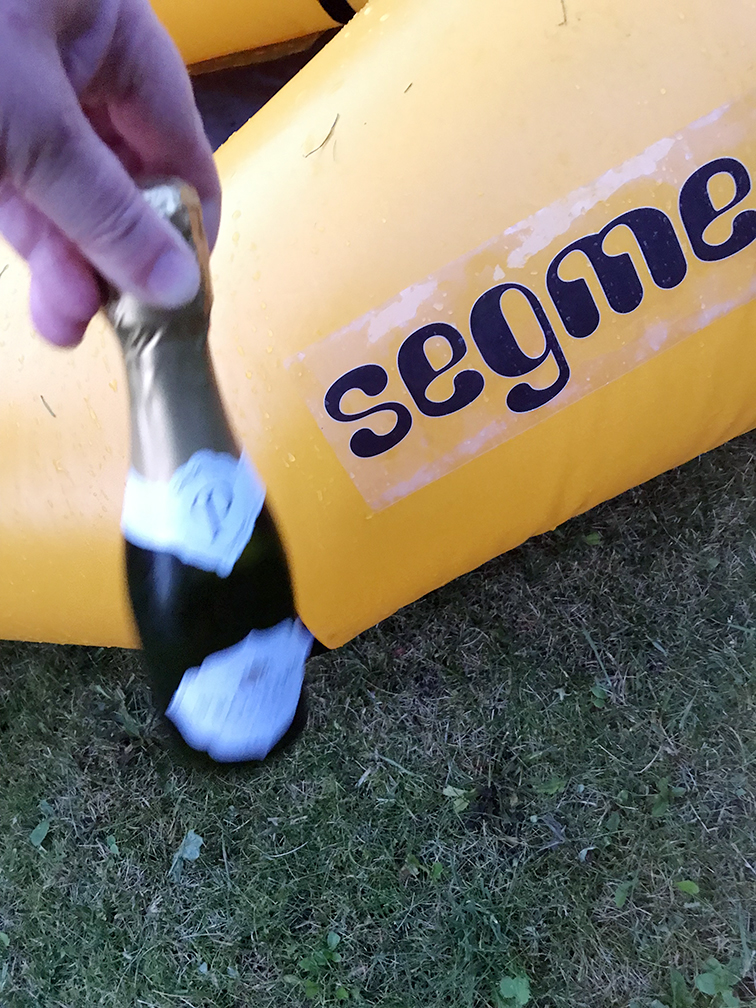 Small bottle of prosecco 'launching' the packraft on its maiden voyage