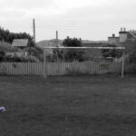 Goalposts and a footbal with a sign reading 'lochmaddy united' 